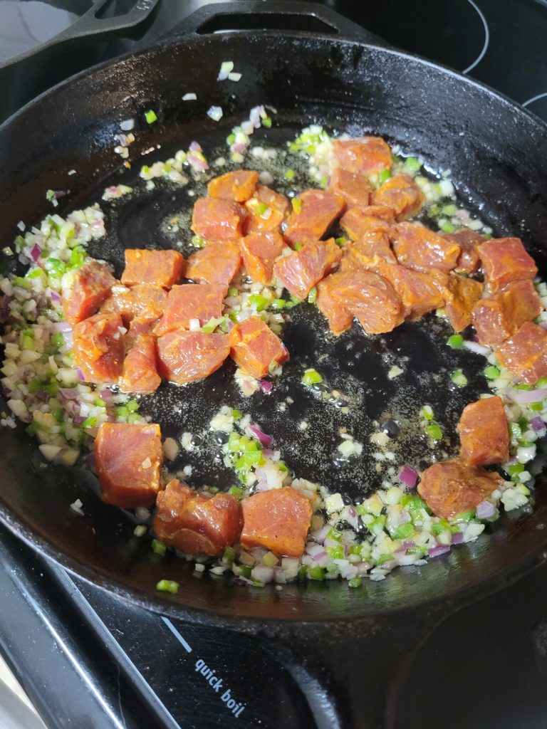 Meat added to pan